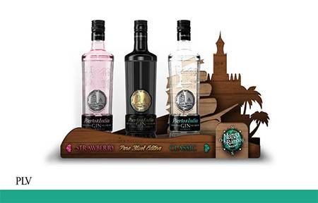Marca tu rumbo: PLV muy vistoso para las tres ginebras. Fondo la carabela y la Torre del Oro